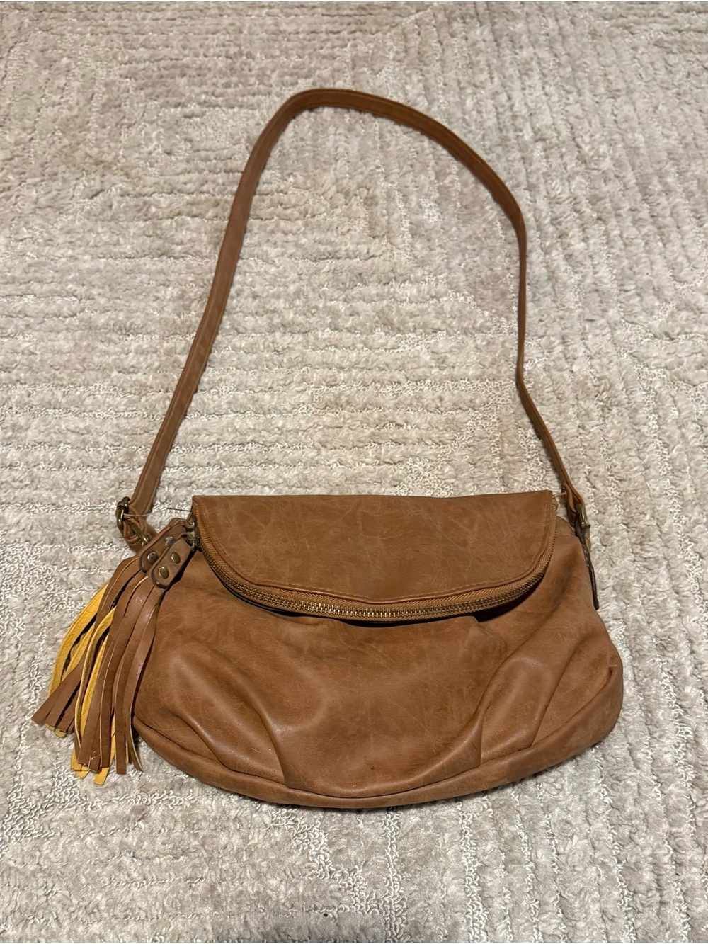 Tan Leather Crossbody Bag with Tassel Accent